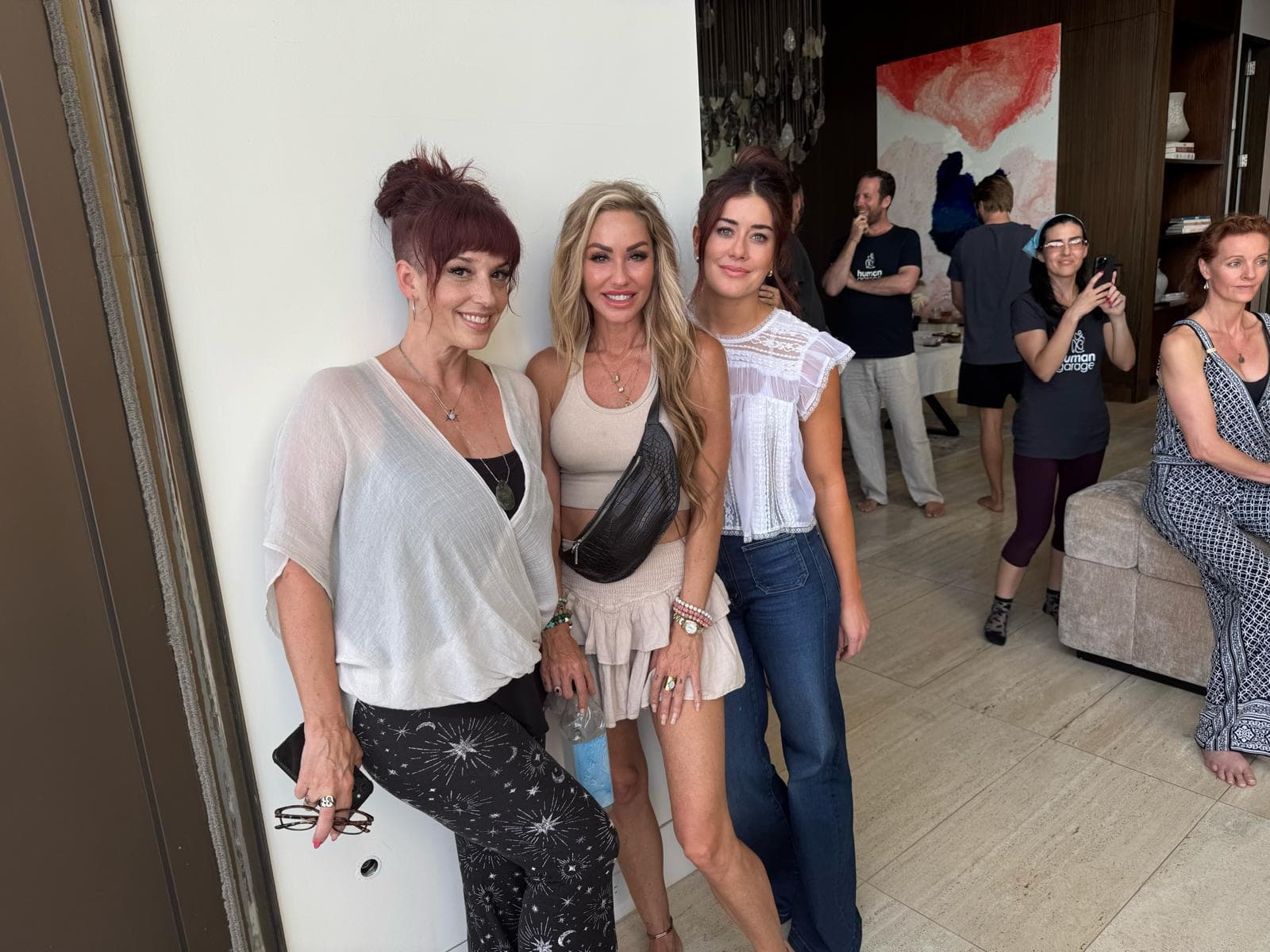 Melanie Marden with two friends at a Human Garage gathering