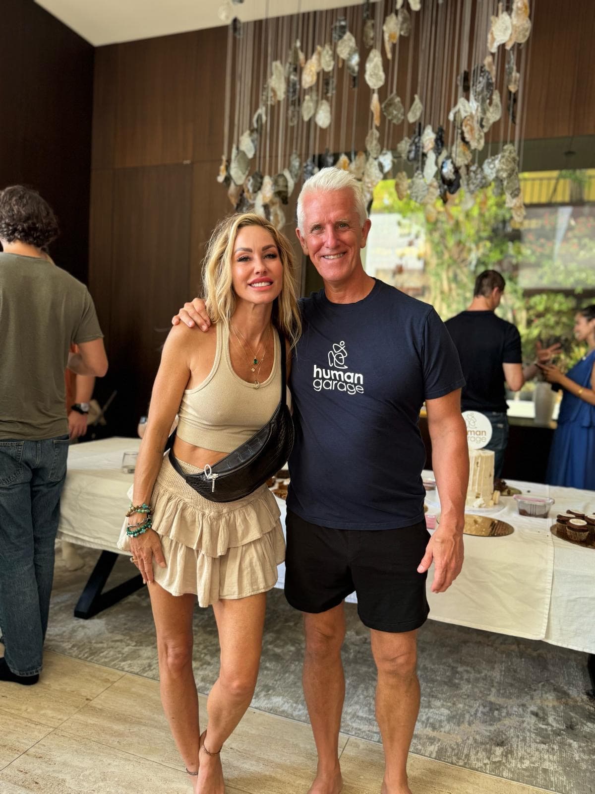 Melanie Marden with a man in a Human Garage shirt