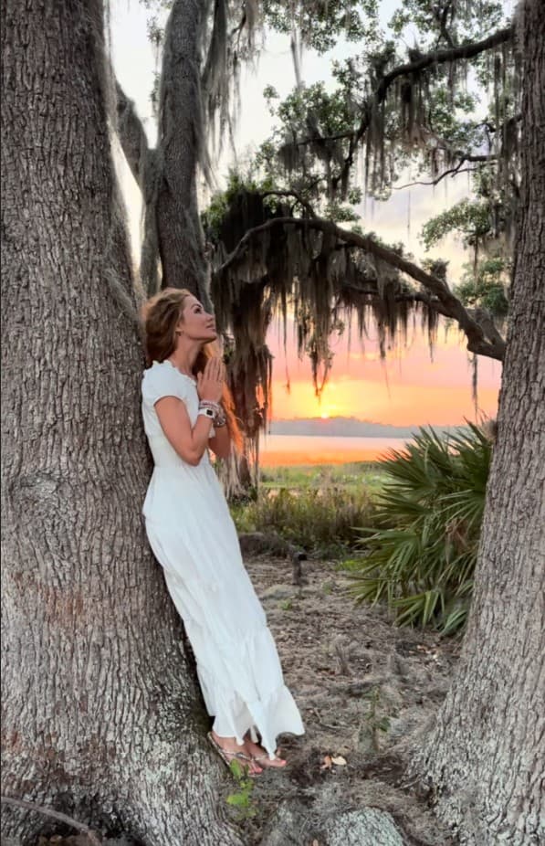 Melanie Marden at sunset beneath a moss-draped oak